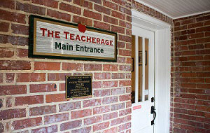 The Teacherage sign outside the building